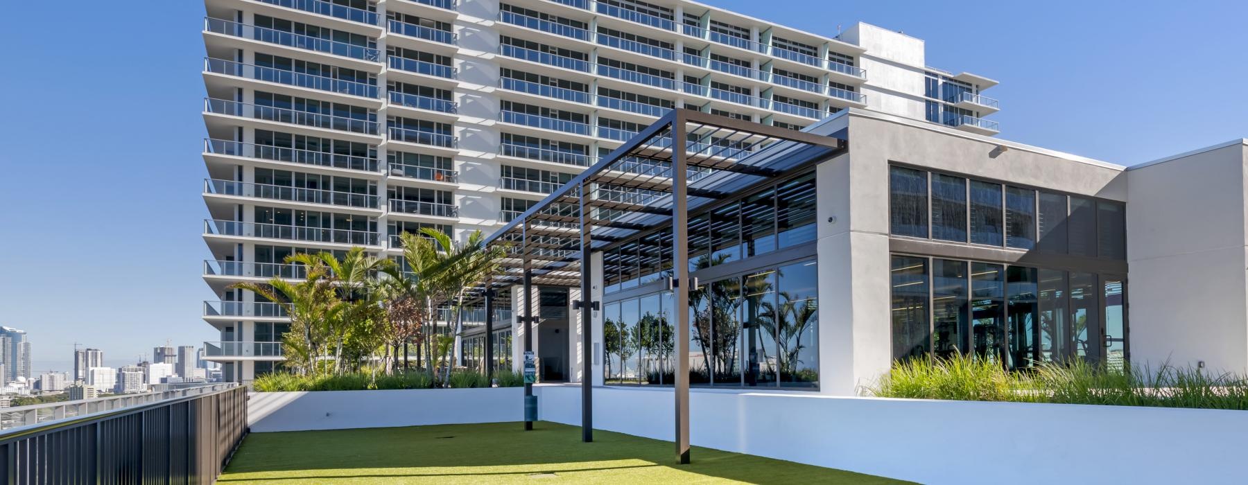 a building with a green lawn